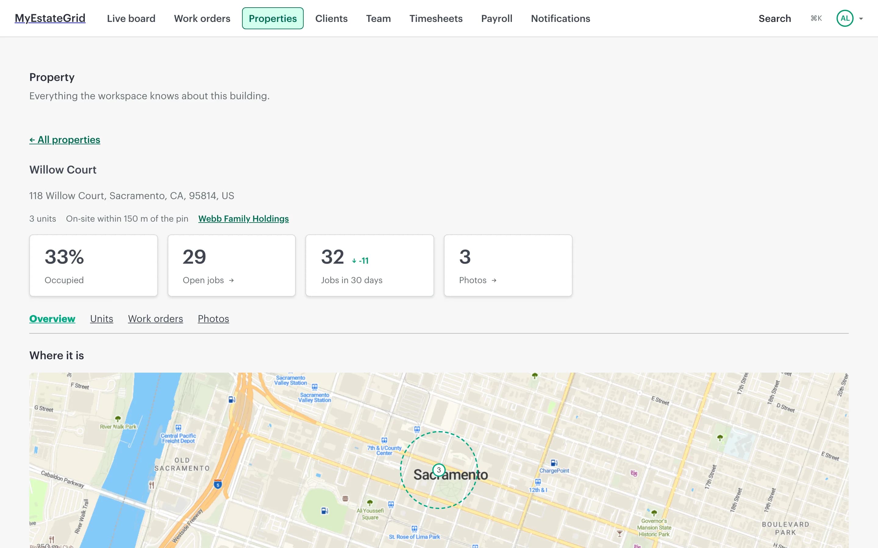 A property page: the building’s name and address, counts of open jobs and occupancy, and a map with the geofence drawn to true radius around the site.